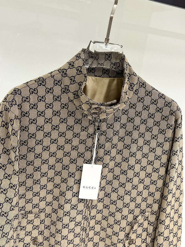 Gucci patterned shirt on a hanger with a visible tag against a white background