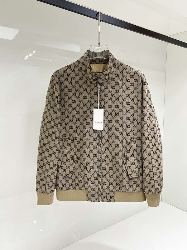 Beige jacket with a pattern on a hanger against a white background