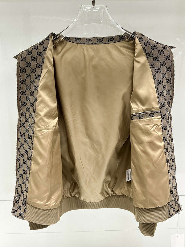 Beige jacket with patterned trim on a white background