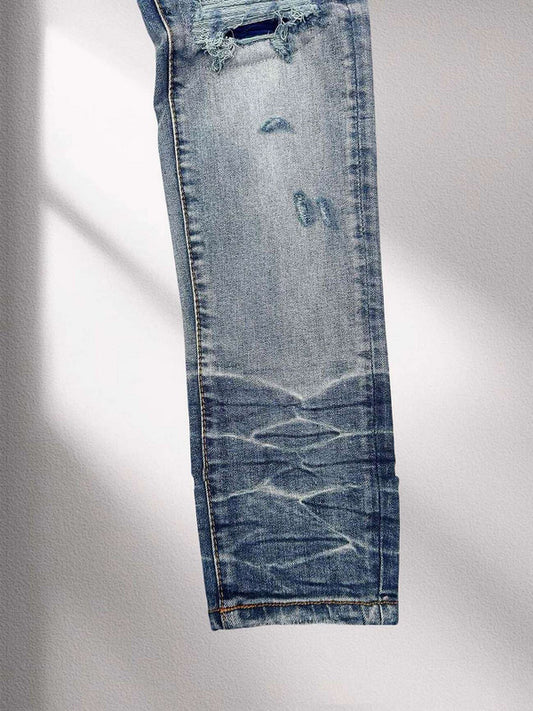 AMIRI Blue Distressed Patchwork Logo Jeans