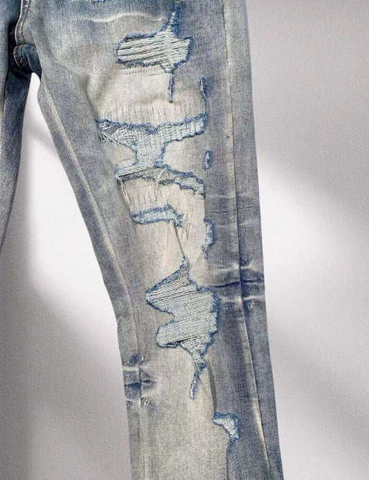 AMIRI Distressed Patchwork Logo Jeans – Light Blue Wash