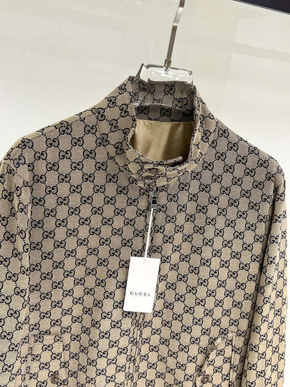 Gucci patterned shirt on a hanger with a visible tag against a white background