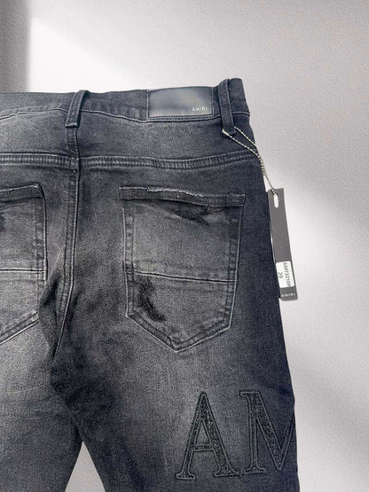 Amiri “Blackout Breakdown” Distressed Denim