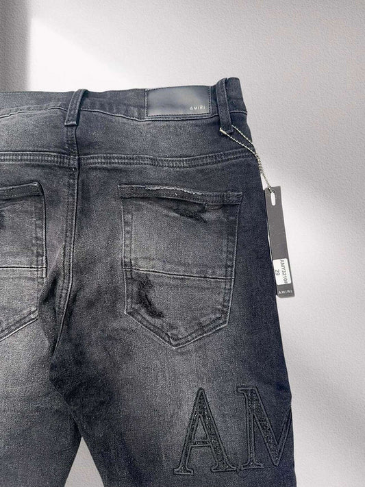 Amiri “Blackout Breakdown” Distressed Denim