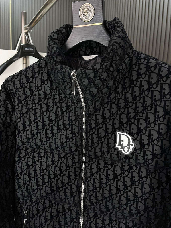 Black patterned jacket with brand logo on a hanger