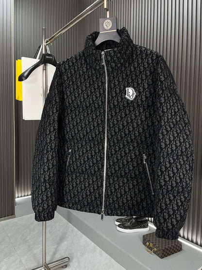 Black textured jacket with a brand logo on a hanger against a neutral background