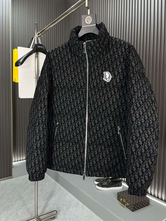 Black textured jacket with a brand logo on a hanger against a neutral background