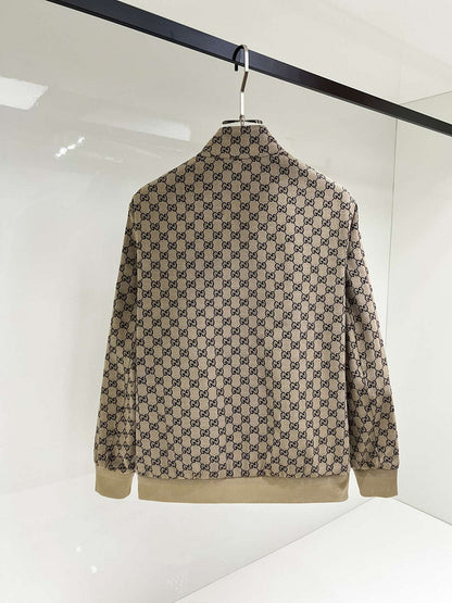 Beige and brown patterned jacket on a hanger against a white background