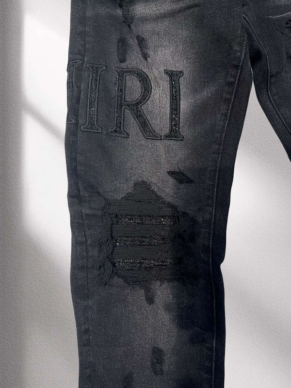 Amiri “Blackout Breakdown” Distressed Denim