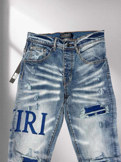 AMIRI Blue Distressed Patchwork Logo Jeans