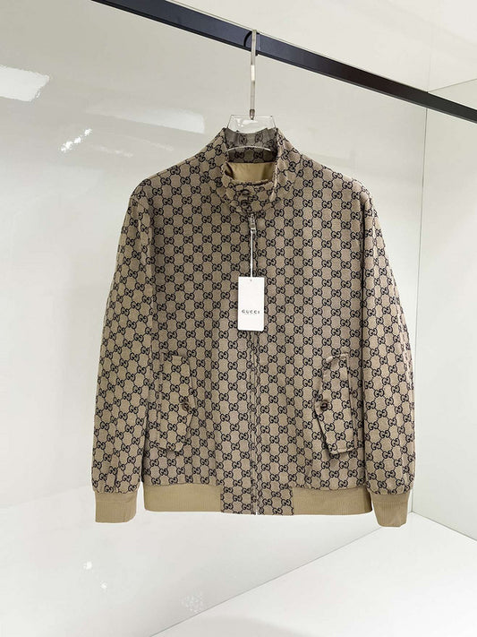 Beige jacket with a pattern on a hanger against a white background